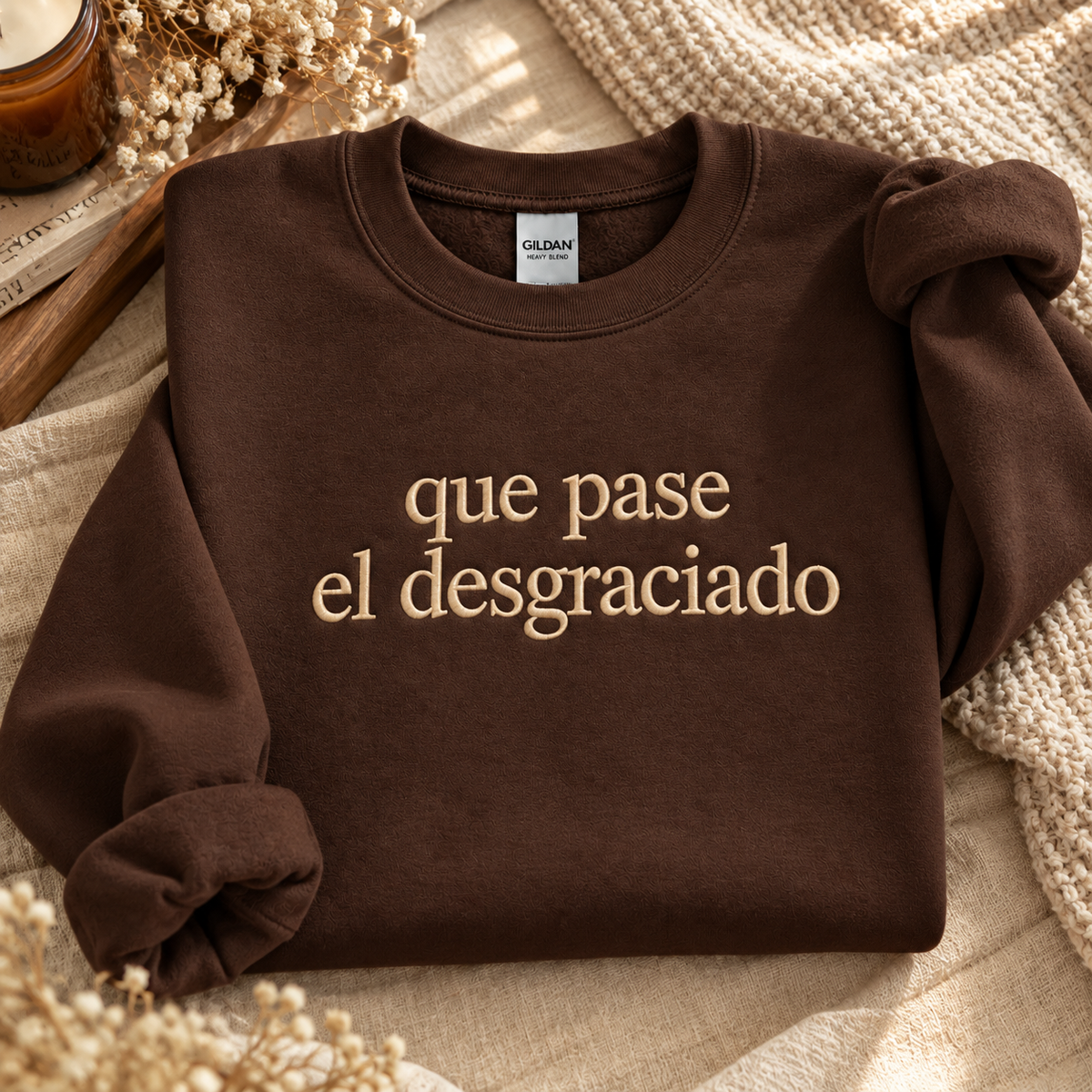 Dark chocolate crewneck with Que Pase El Desgraciado embroidery