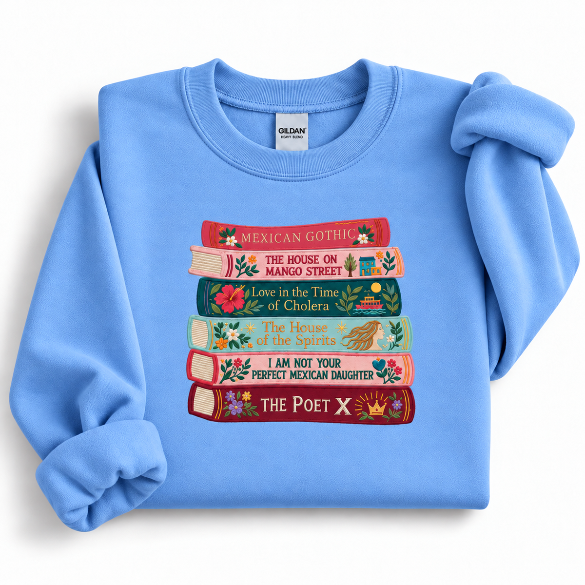 Carolina Blue Gildan 18000 sweatshirt with colorful embroidered book spines, flowers, and literary illustrations.