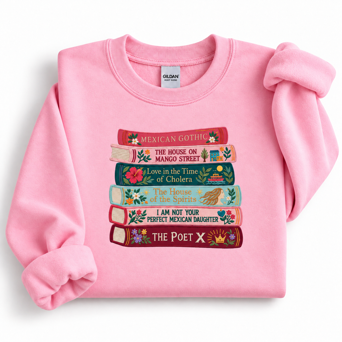 Light Pink Gildan 18000 sweatshirt featuring a colorful embroidered stack of six Latina and Latin American literary books.